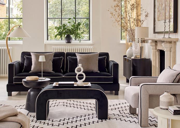 Black and white sofa and accent chair with matching footstool
