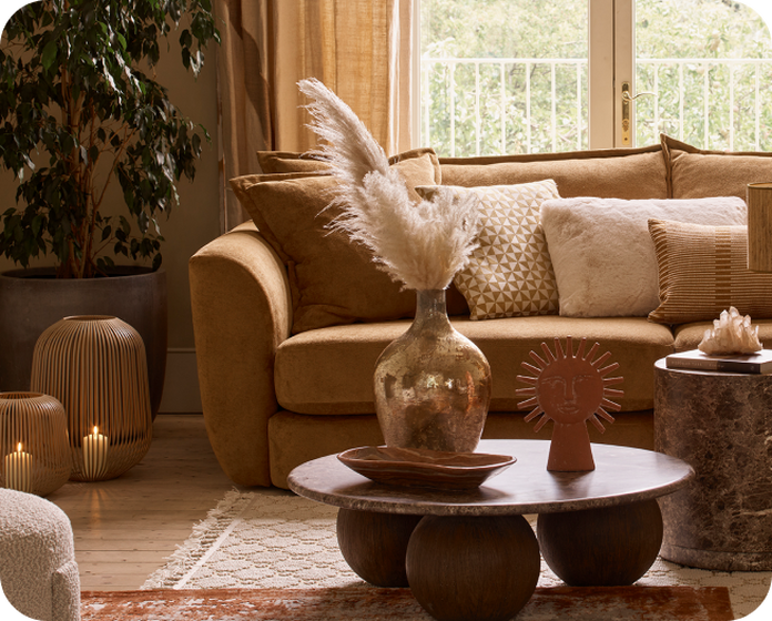 brown sofa in a dark neutral room