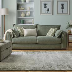 green fabric sofa with pattern scatter cushions