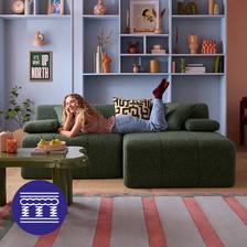 Women laid on the sofa admiring her living space
