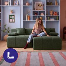 Women feeling the fabric of her sofa
