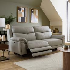 Light grey leather recliner sofa in a bright living room