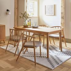 Oak dining table with four spindle dining chairs