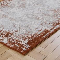 abstract distressed style rug in orange and cream