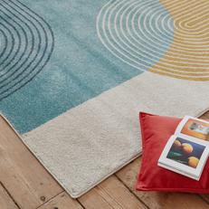 retro inspired rug with blue and yellow graphics