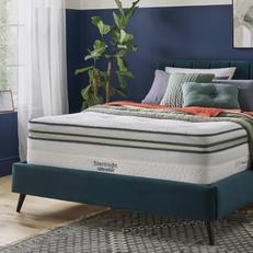 Teal divan bed next to a navy blue wall with a Silentnight mattress 