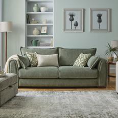 green somerford sofa next to a sage green wall