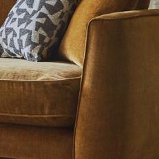 Close up of a mustard chenille fabric on a sofa