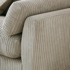 Close up of beige jumbo cord fabric on a sofa