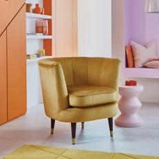 yellow velvet barrel chair with black legs