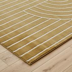 close up of a yellow and patterned rug