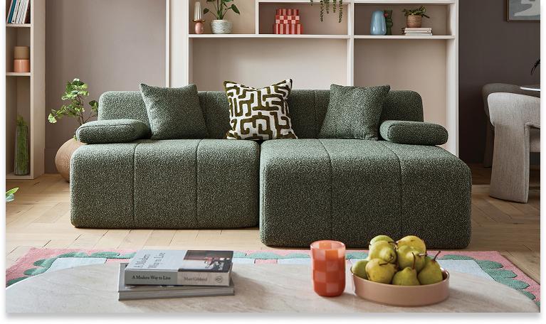 OnCloud9 Modum Express Corner Sofa with monochrome scatter cushions next to an oak coffee table