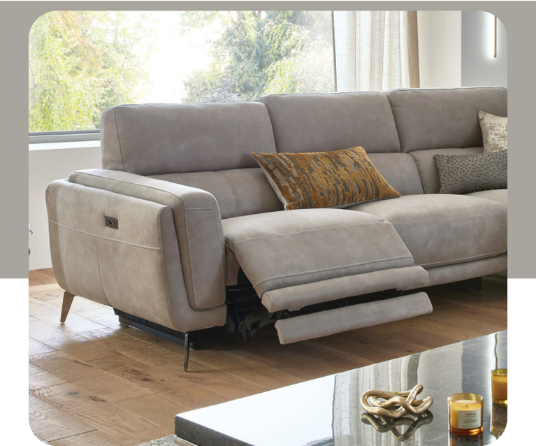 grey faux leather sofa with zebra print scatter cushions