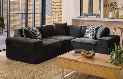 OnCloud9 Flux Corner sofa in a cosy living space with monochrome scatter cushions