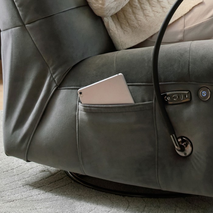 close up of a table inside a pocket of a swivel chair