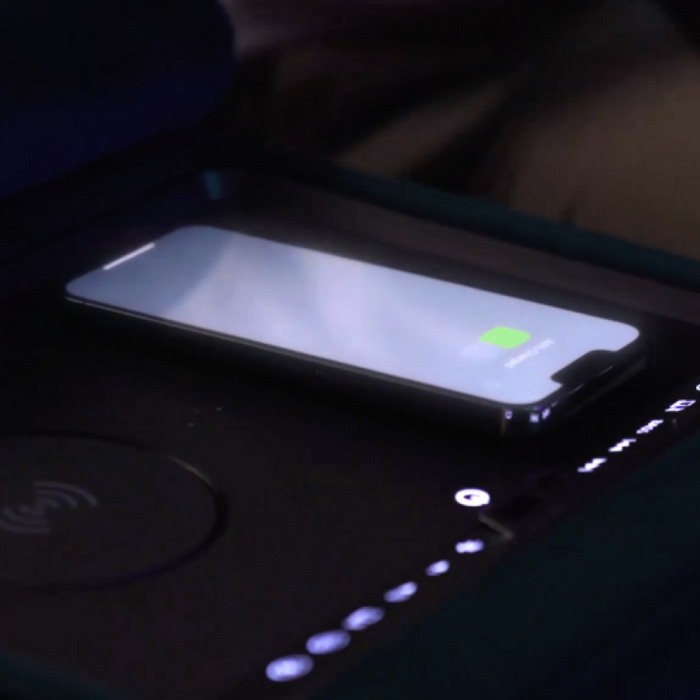 close up of a phone charging on a wireless charger