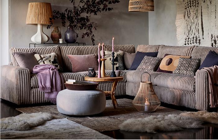 jumbo cord corner sofa in a dark cosy living room