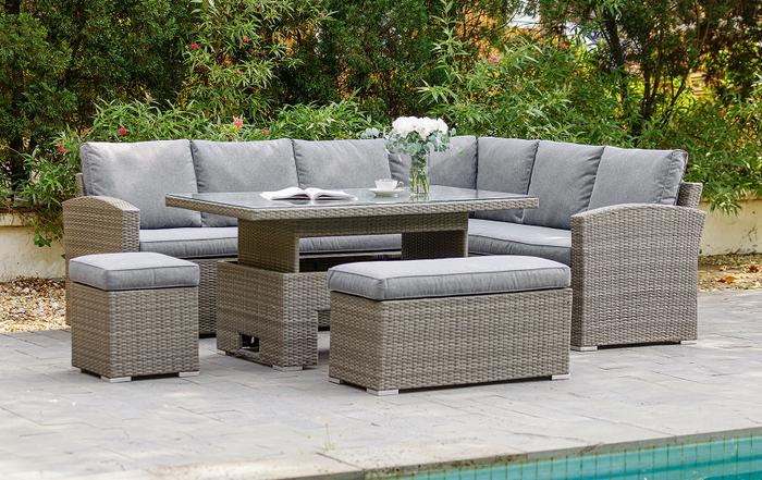 Grey rattan corner garden sofa with rising dining table and two chairs
