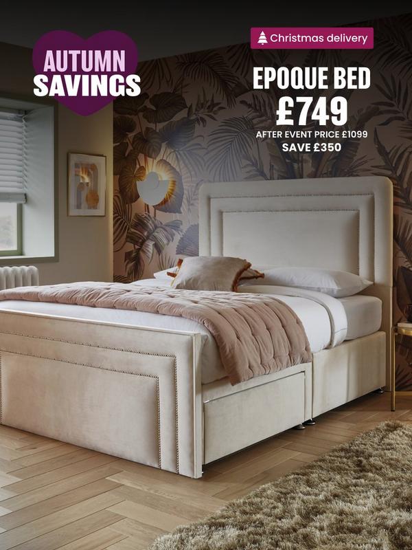 Cream bed with seam detail on head board