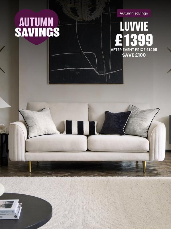 Cream sofa with matching scatters and a monochrome striped bolster