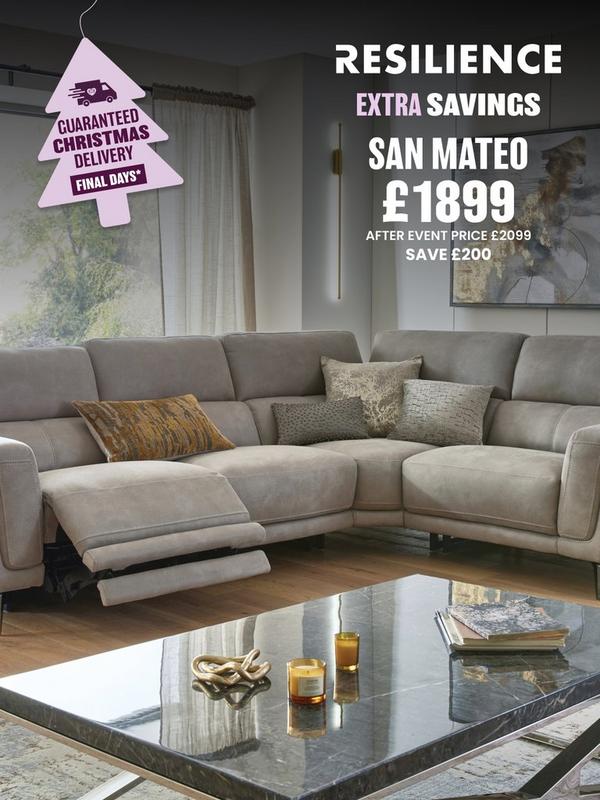 Stone coloured corner sofa with reclining features on footrest with selection of scatter cushions