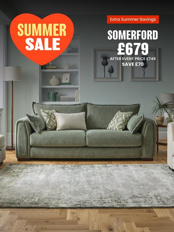 Sage green sofa with complimentary scatter cushions 