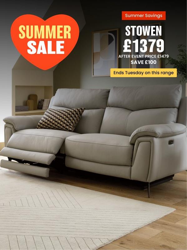 Light grey leather recliner sofa with coffee table and shelving