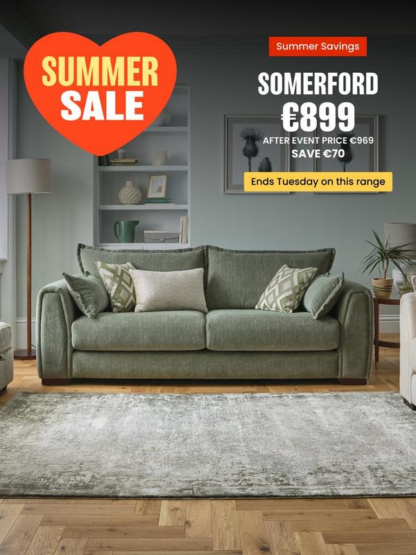 Sage green sofa with complimentary scatter cushions 