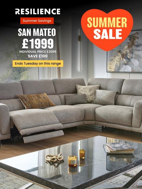 Stone coloured corner sofa with reclining features on footrest with selection of scatter cushions