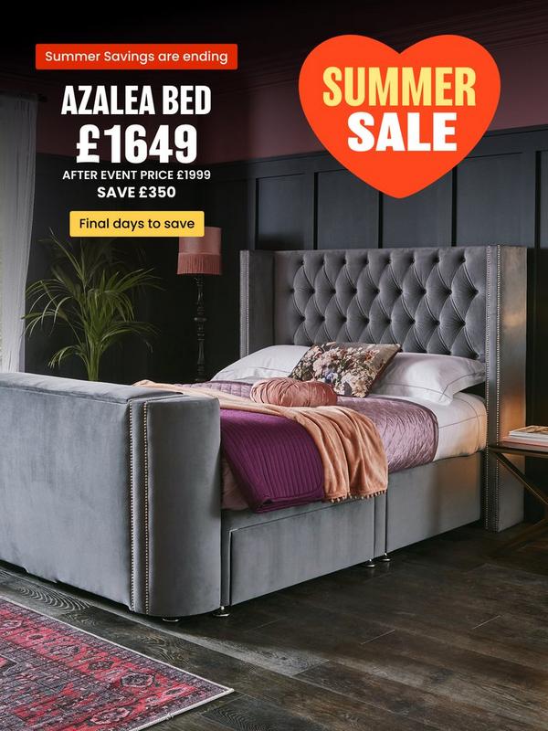 Grey tv bed with button back detail on headboard