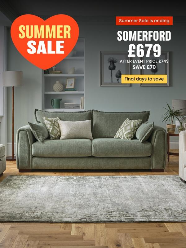 Sage green sofa with complimentary scatter cushions 