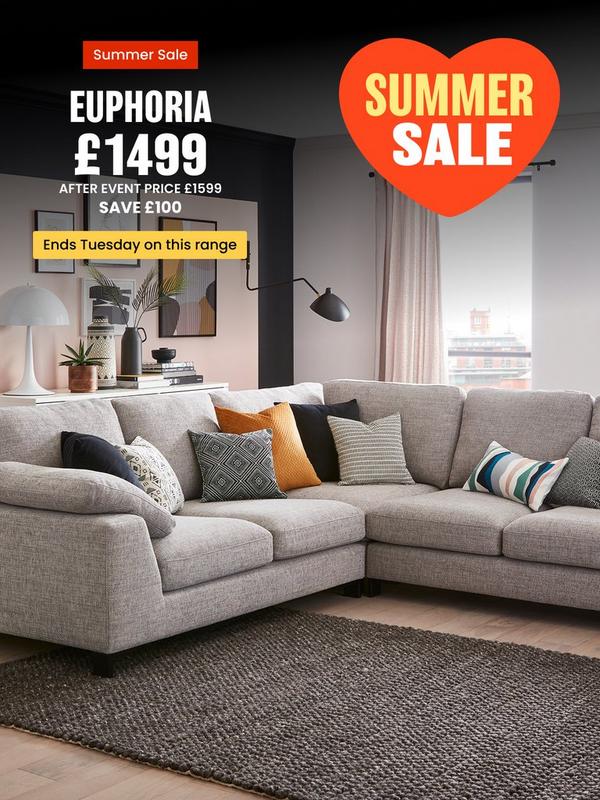 Grey corner sofa with a selection of scatter cushions 