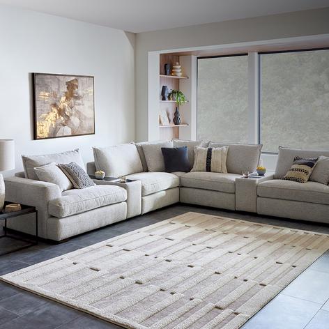 Oyster coloured large corner sofa with cream rug