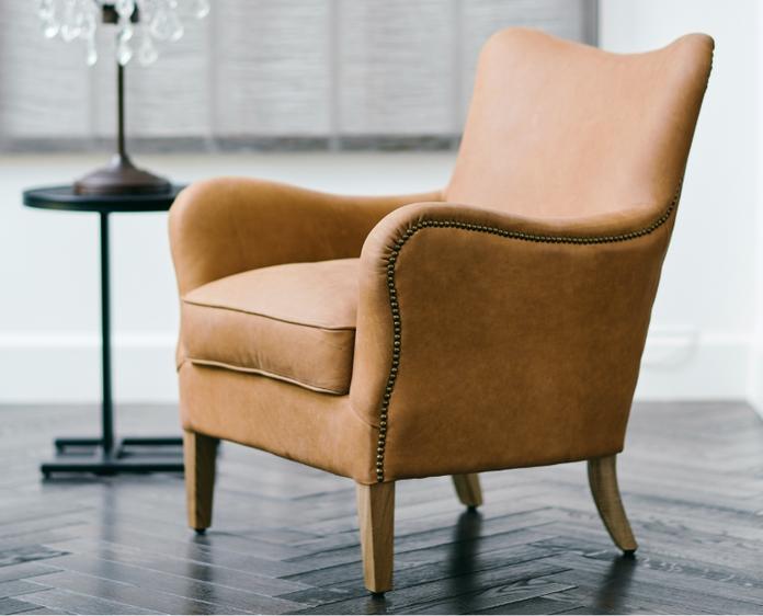 Brown armchairs and footstools