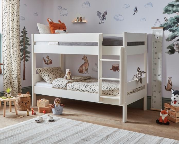 White compact bunk bed in a childs bedroom with cuddly animal teddies
