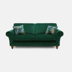 Green velvet fabric sofa with scatter cushions 
