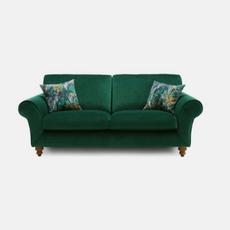 green fabric sofa with scatter cushions