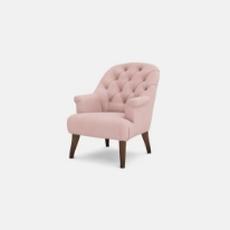 Pale pink accent chair with buttoned back