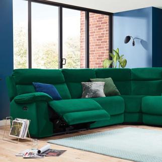 Green corner sofa in a blue living room and light blue rug