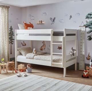 White compact bunk bed in a childs bedroom with cuddly animal teddies