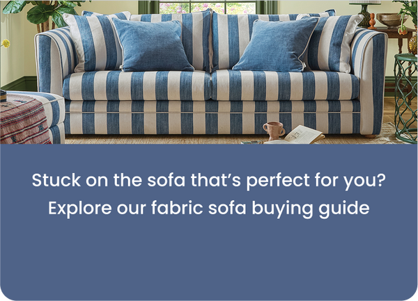 white and blue stripy sofa with two blue scatter cushions