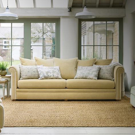 pale yellow sofa with scatter cushions