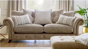 beige pillow back sofa with patterned scatter cushions