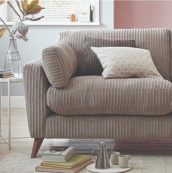 close up of a jumbo cord brown sofa 