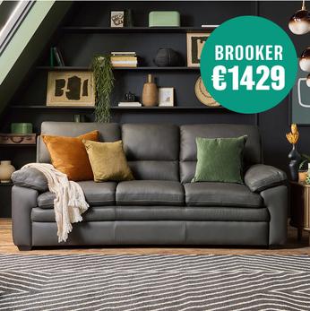 charcoal recliner sofa with earthy tonal scatter cushions