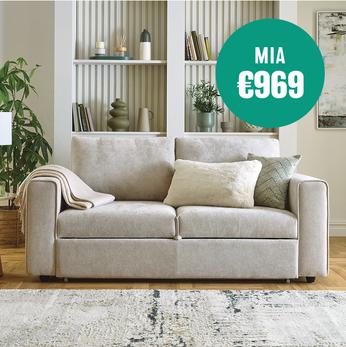taupe sofa with accessories behind on reeded shelves