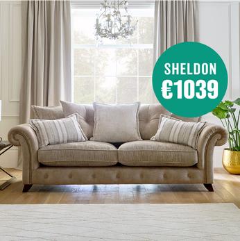 Caramel coloured pillow back sofa with wing arm detail