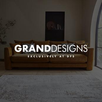 orange fabric sofa with black and white cushions and the grand designs logo sat on top