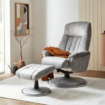 light grey recliner chair with footstool with an orange throw