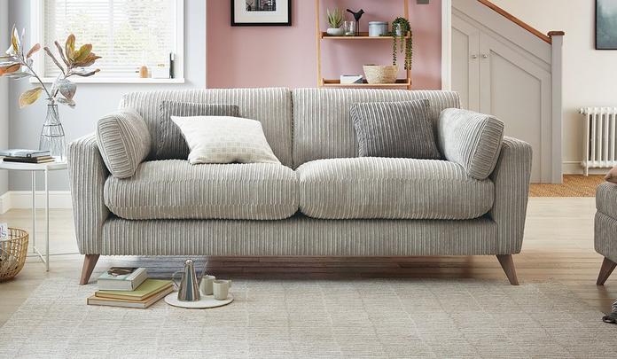 light grey jumbo cord sofa on a fluffy rug